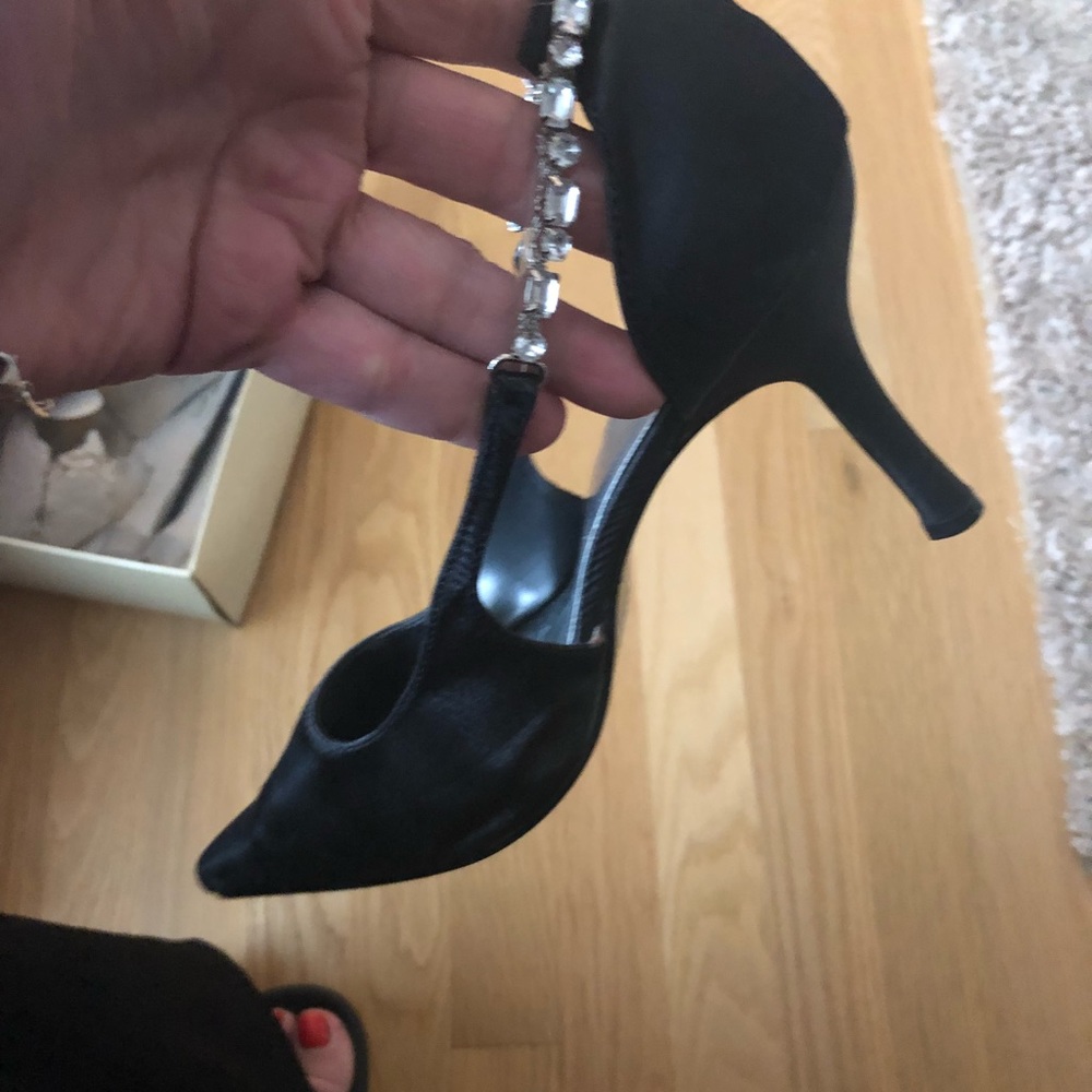 Black satin pumps